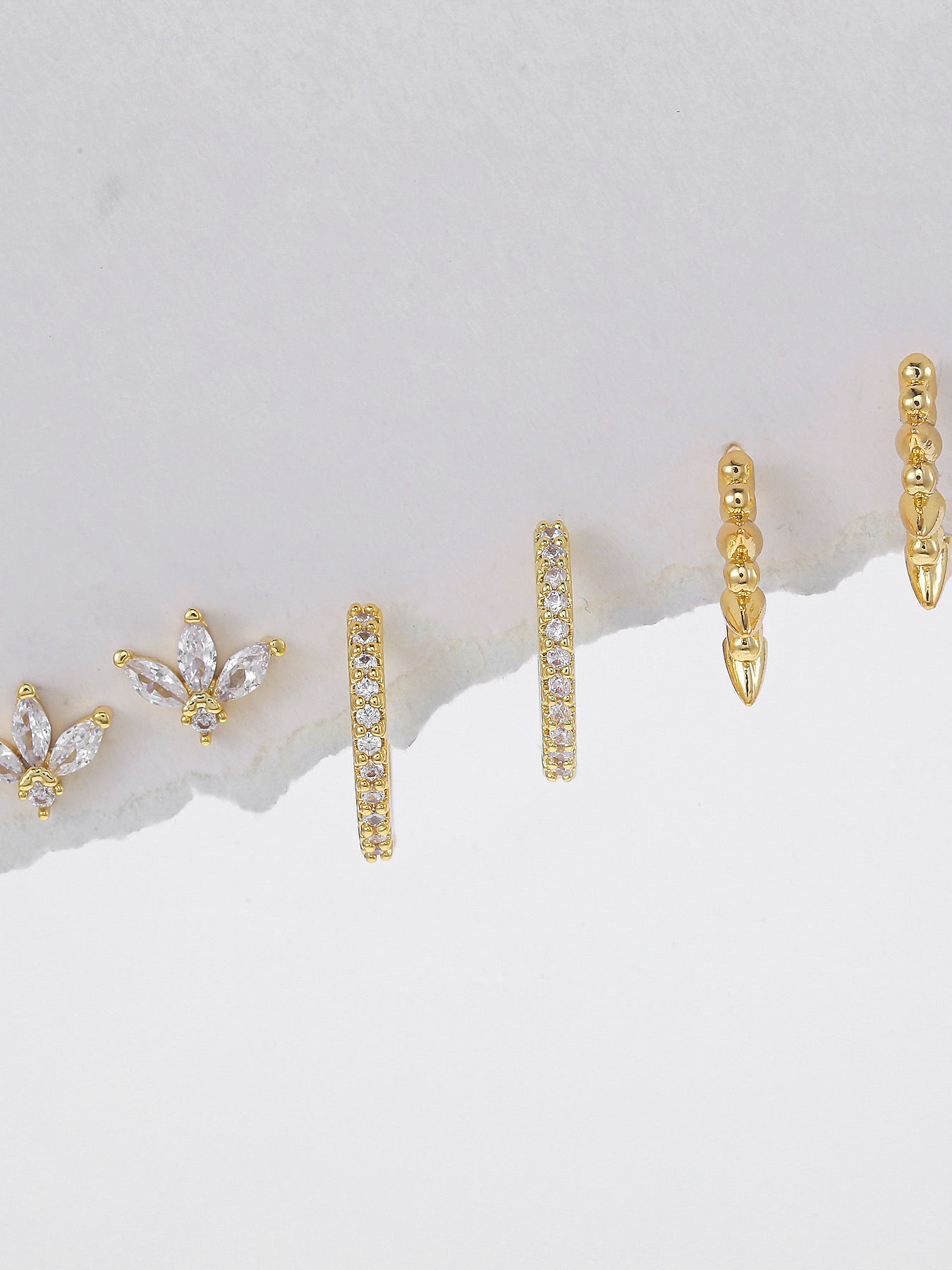 Pair of gold-plated hoop piercing earrings — curated set for everyday styling and layered ear stacks.