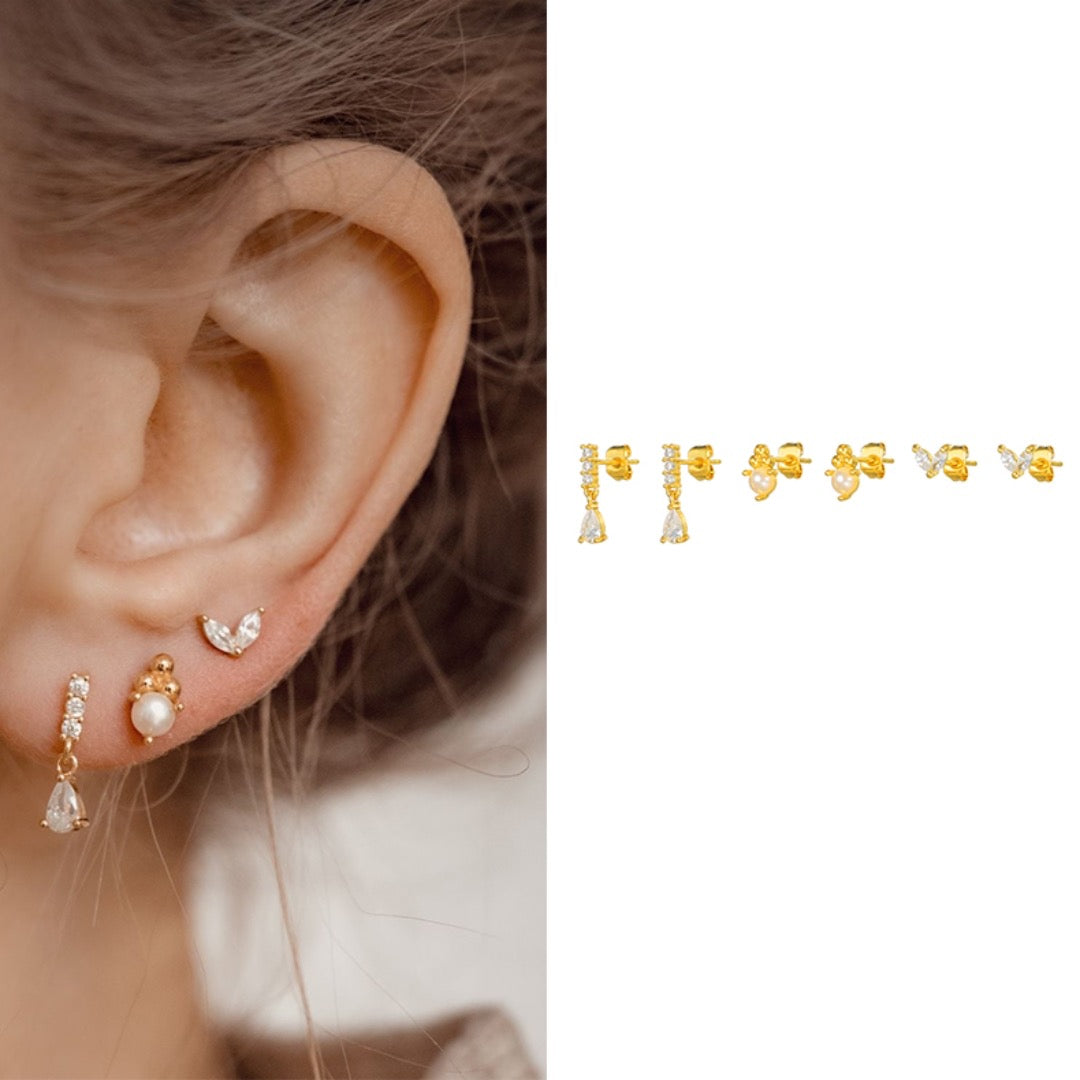 Close-up of stone drop piercing earrings — 18k gold-plated curated set for evening and gifting.