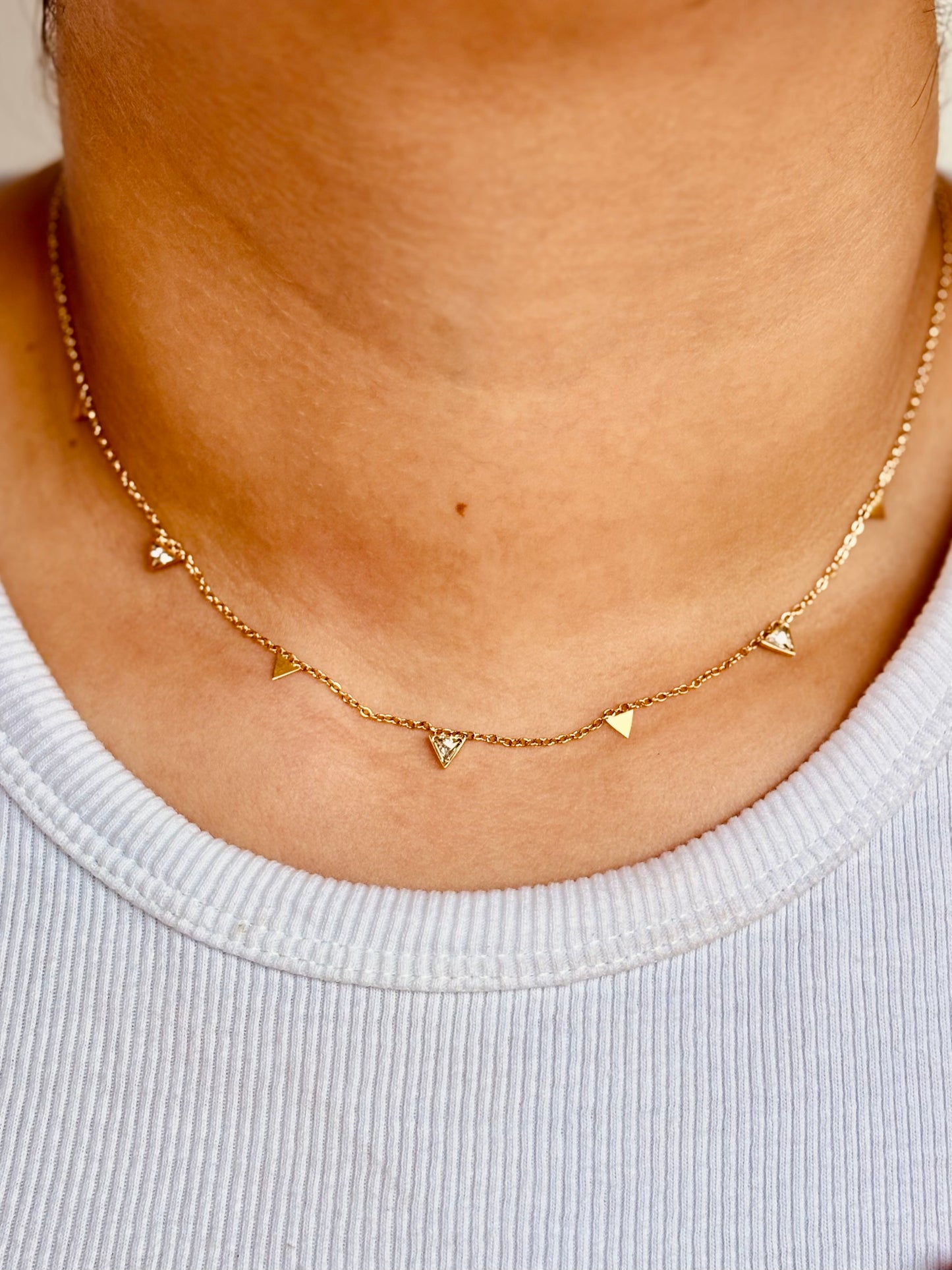 Claire gold-plated triangle stone choker styled flat — elegant statement necklace for everyday and festive.