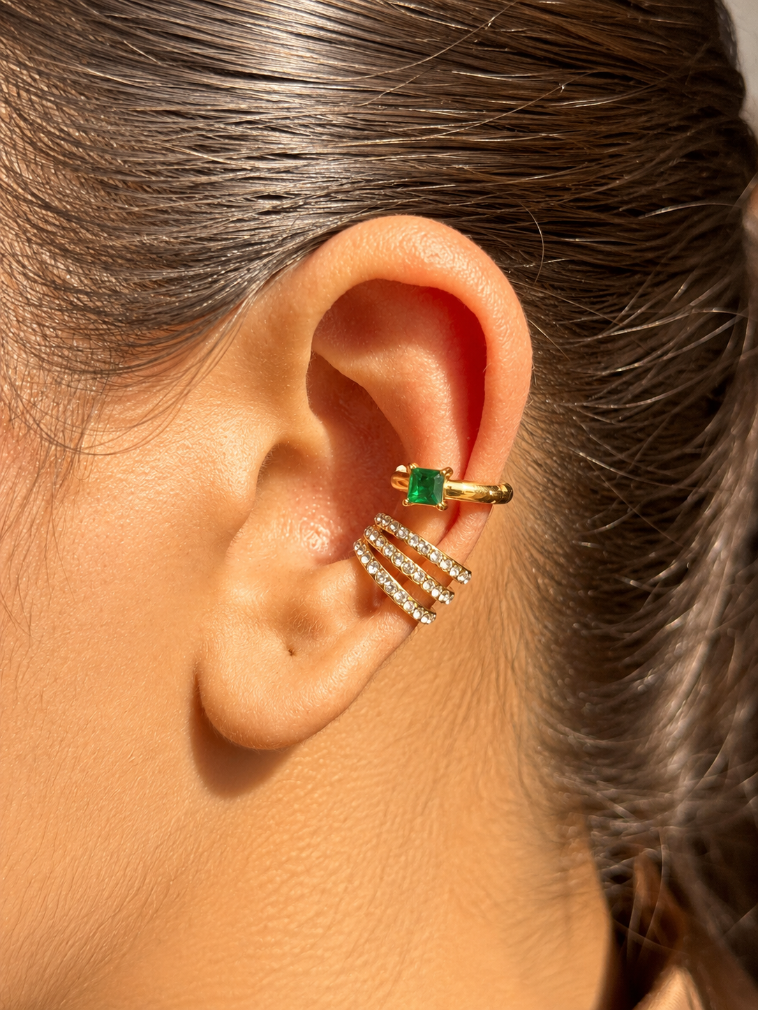 Close-up of Mira gold-plated ear cuff — sleek 18k gold-plated statement no-piercing single-piece cuff.