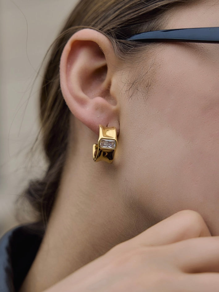 Close-up of Rhea drop earrings — 18k gold-plated statement drops for ethnic and evening outfits.