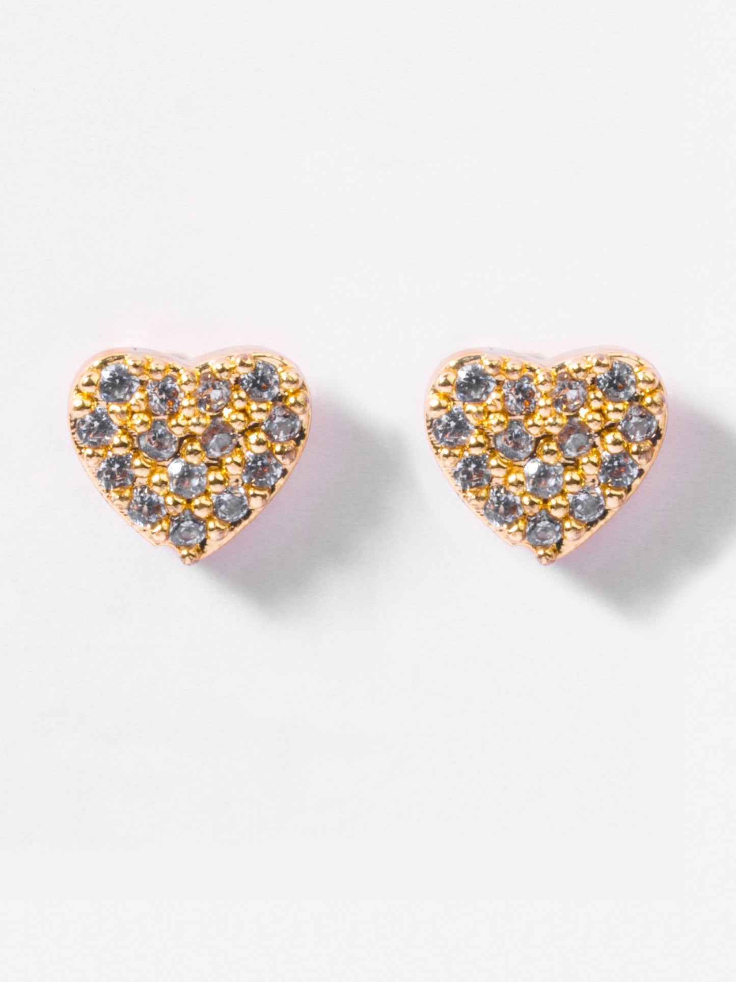 Close-up of heart flat-back stud earrings — 18k gold-plated sleek modern heart studs for casual wear.
