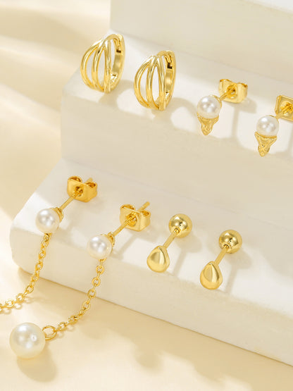 Styled view of pearl drop piercing set — 18k gold-plated curated pearl earrings for bridal and gifting.
