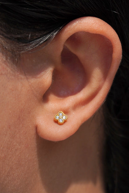 Close-up of 18k gold-plated clover stud earrings — ball-back, lightweight, anti-tarnish design for daily wear.