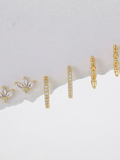 Pair of gold-plated hoop piercing earrings — curated set for everyday styling and layered ear stacks.