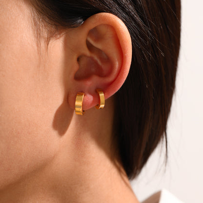 Styled view of Ira gold ear cuff — sleek 18k gold-plated no-piercing single-piece cuff for festive ear stacks.