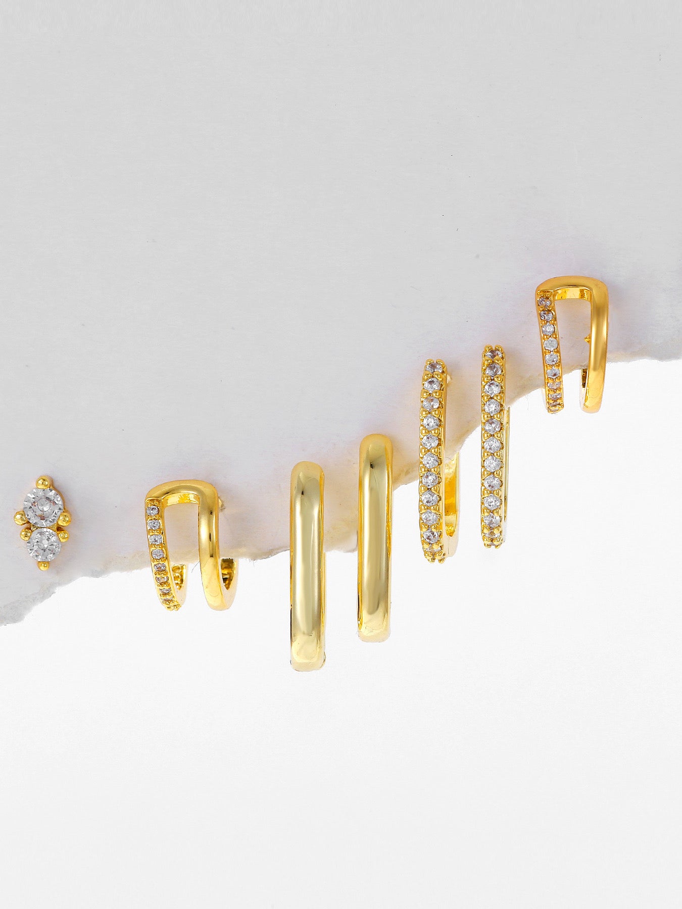 Pair of gold-plated iconic piercing earrings — lightweight curated set for everyday styling and gifting.