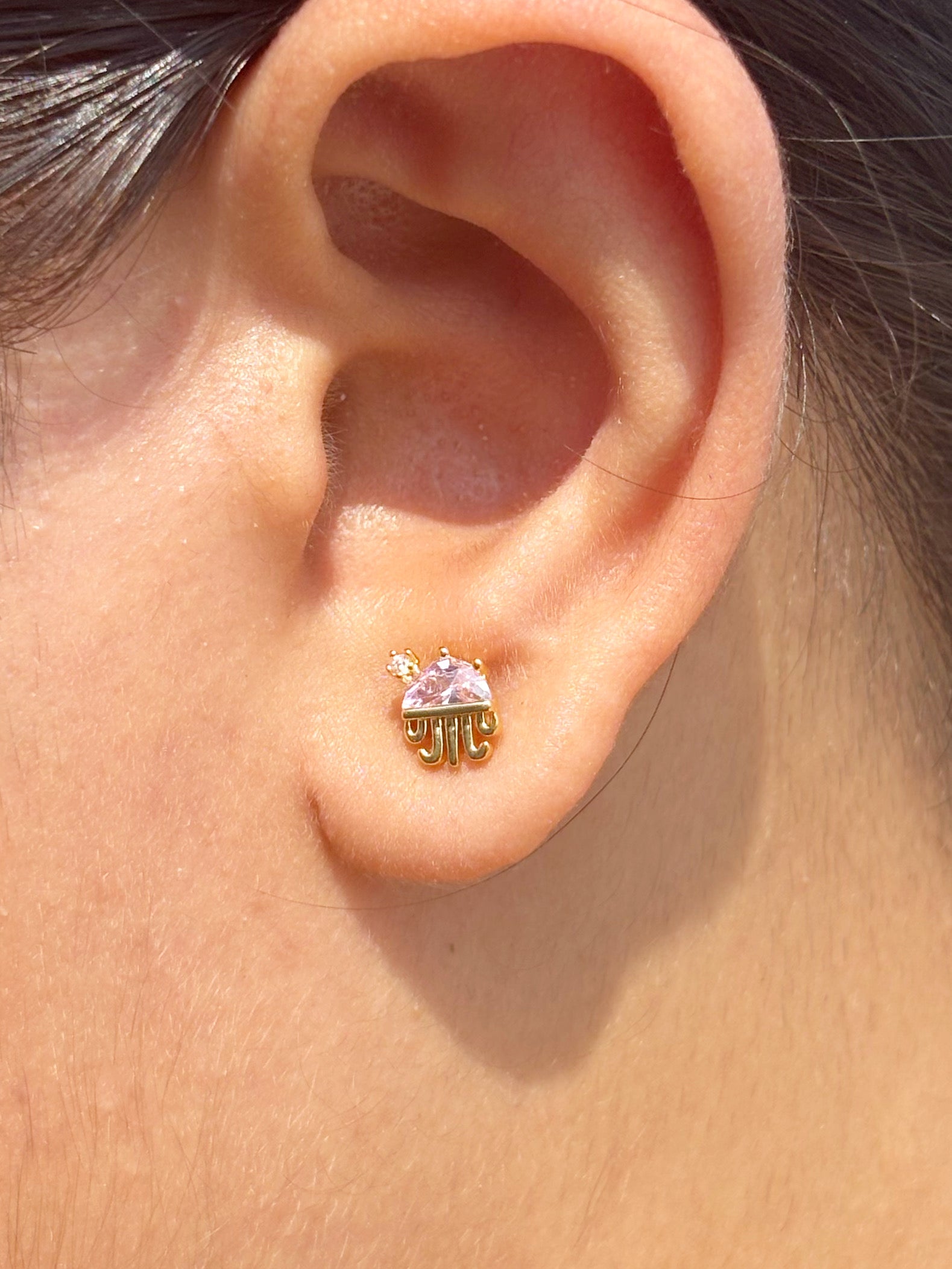 Close-up of umbrella ball-back stud earrings — 18k gold-plated playful sleep-friendly umbrella studs for casual wear.