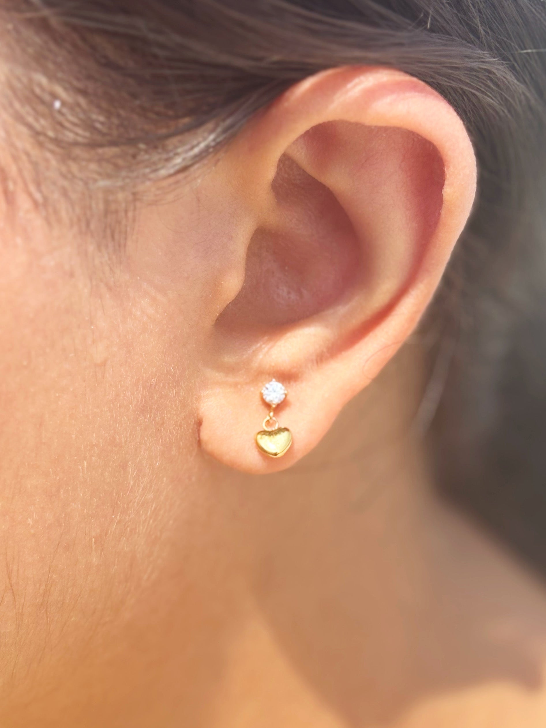Detail shot of heart drop flat-back stud earrings — 18k gold-plated minimal heart drop studs for everyday and gifting.