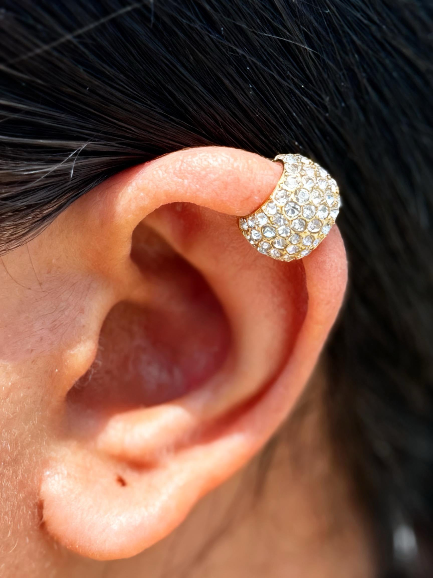 Close-up of chunky gold ear cuff — bold 18k gold-plated single-piece cuff for festive styling and ear stacks.