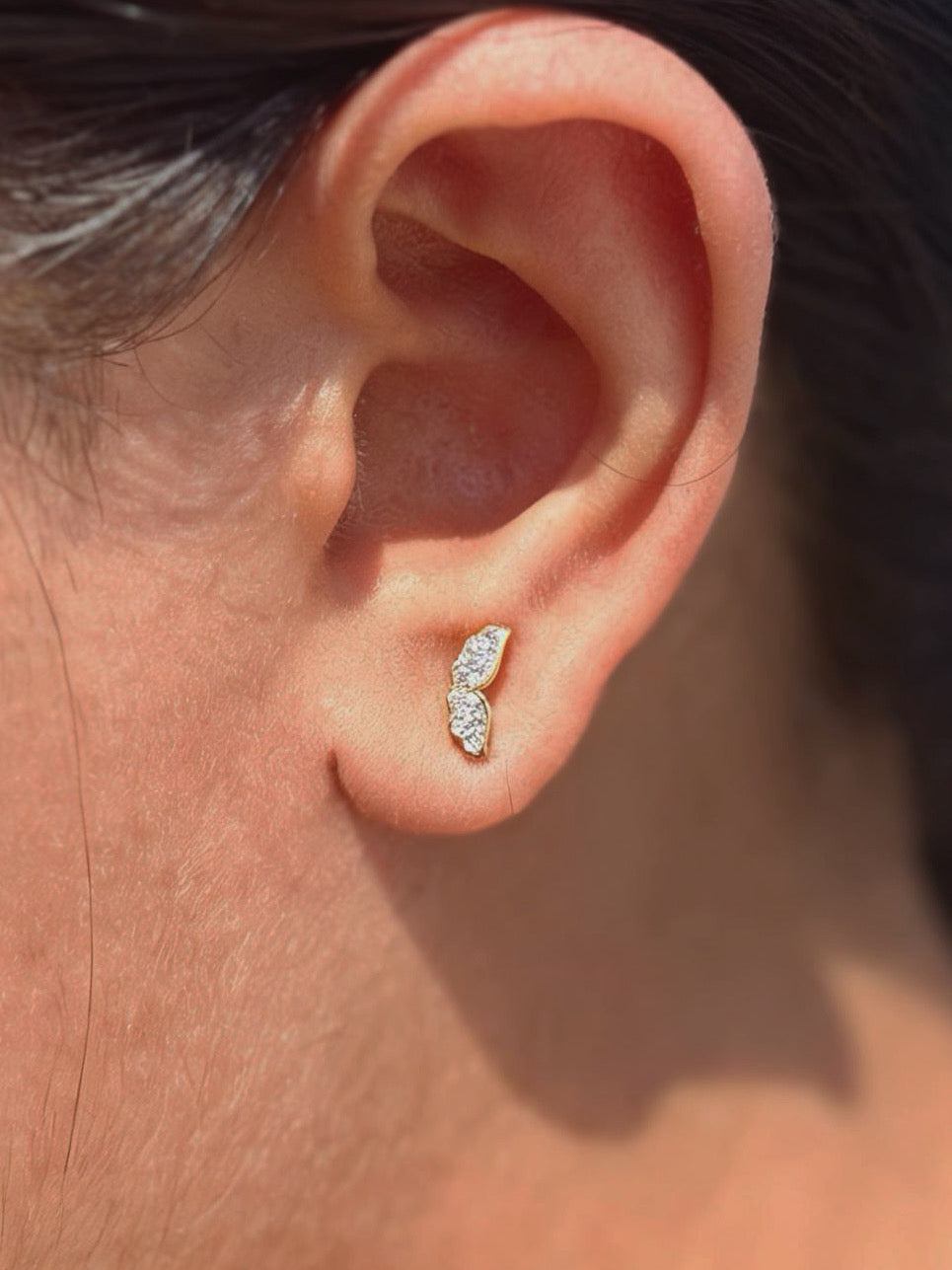 Detail shot of wing ball-back stud earrings — 18k gold-plated wing studs for everyday and gifting.