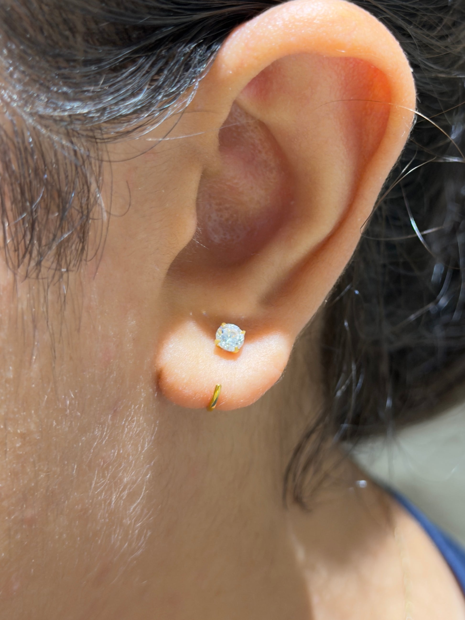 Styled view of 925 sterling silver comfy stone hoops (40 cent size) — fully adjustable, poke-free hoops for everyday, evening, and sleep-safe wear.