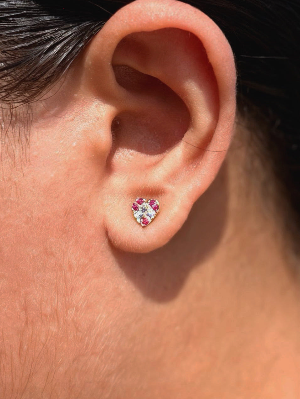 Close-up of colourful heart ball-back stud earrings — 18k gold-plated playful heart studs for casual wear.