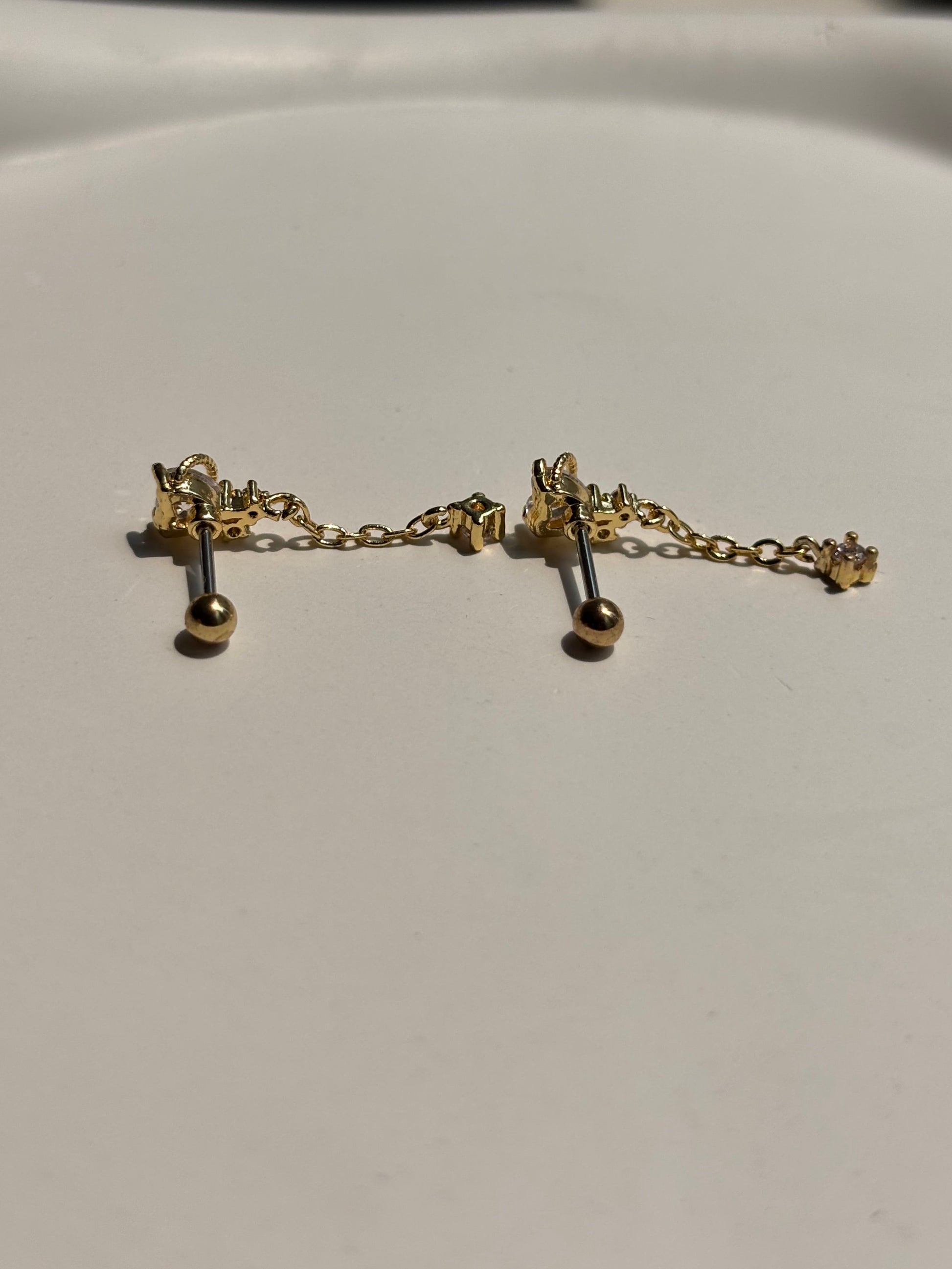 Close-up of stone drop ball-back stud earrings — 18k gold-plated sleep-friendly stone drop studs for casual wear.