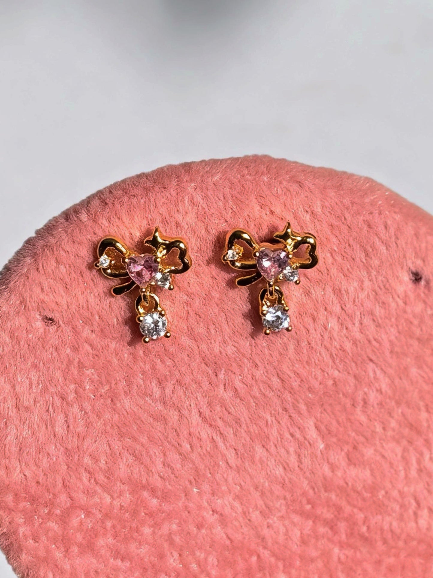 Pair of gold-plated bow studs — sweet minimal bow earrings styled for everyday and casual wear, gifting.