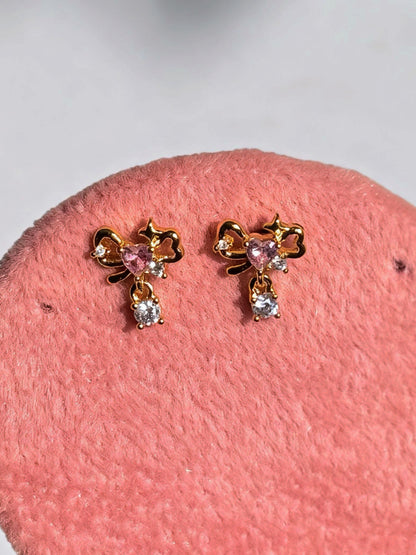 Pair of gold-plated bow studs — sweet minimal bow earrings styled for everyday and casual wear, gifting.