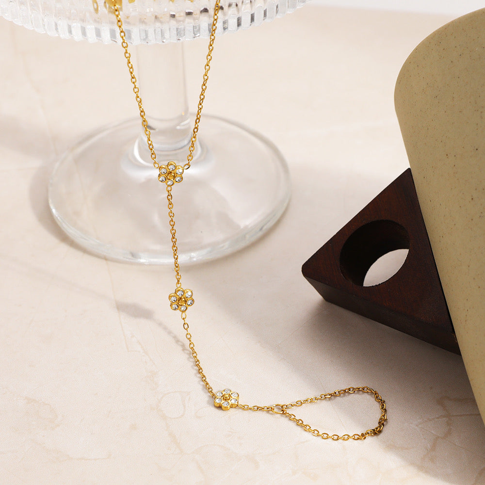 Styled view of flower hand-chain — dainty 18k gold-plated bracelet for everyday and casual wear.