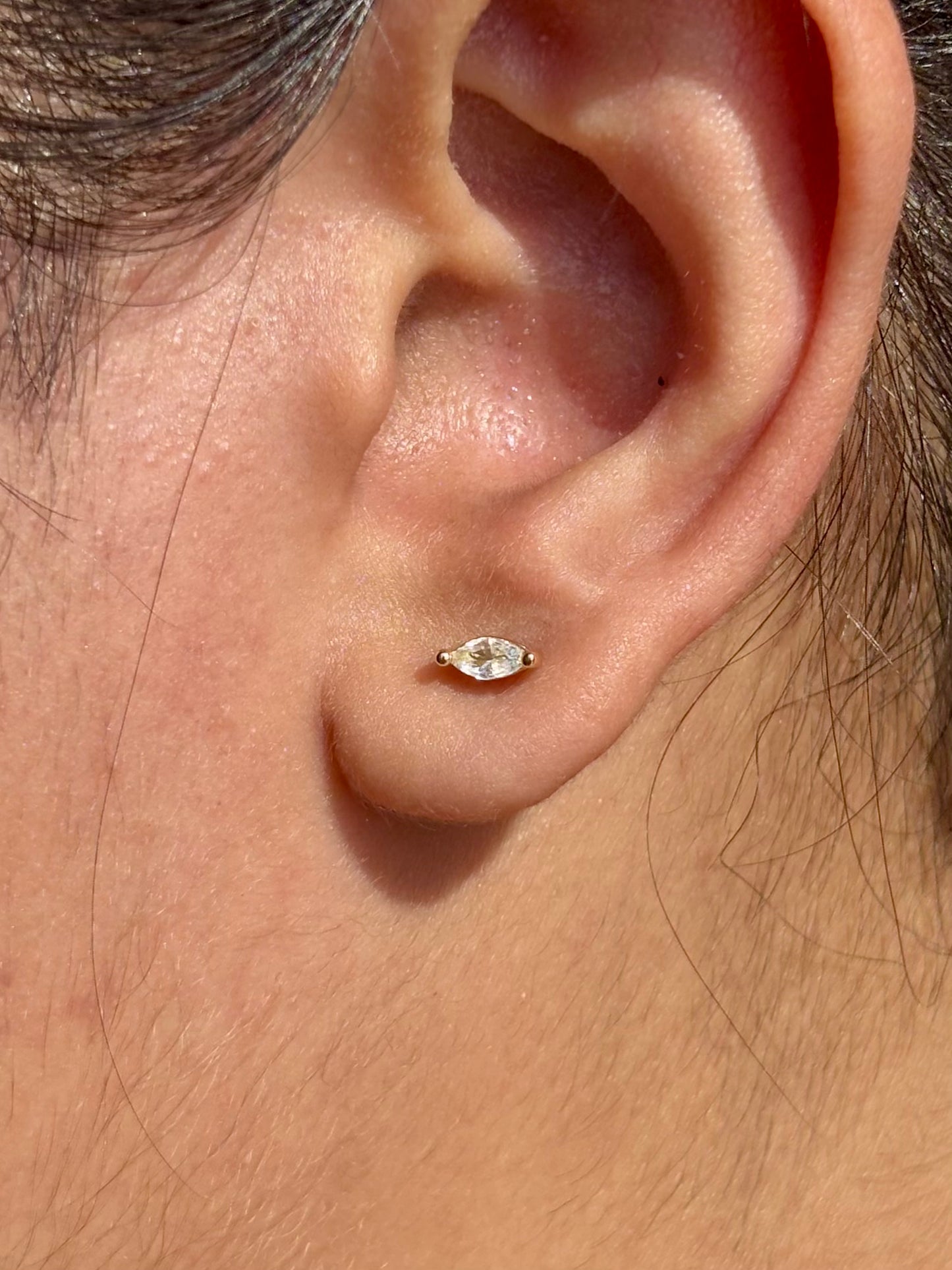 Close-up of bezel stone flat-back stud earrings — 18k gold-plated comfort studs, anti-tarnish and waterproof.