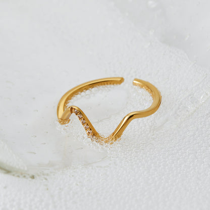 Close-up of wave ring — 18k gold-plated minimal everyday ring for office and casual styling.
