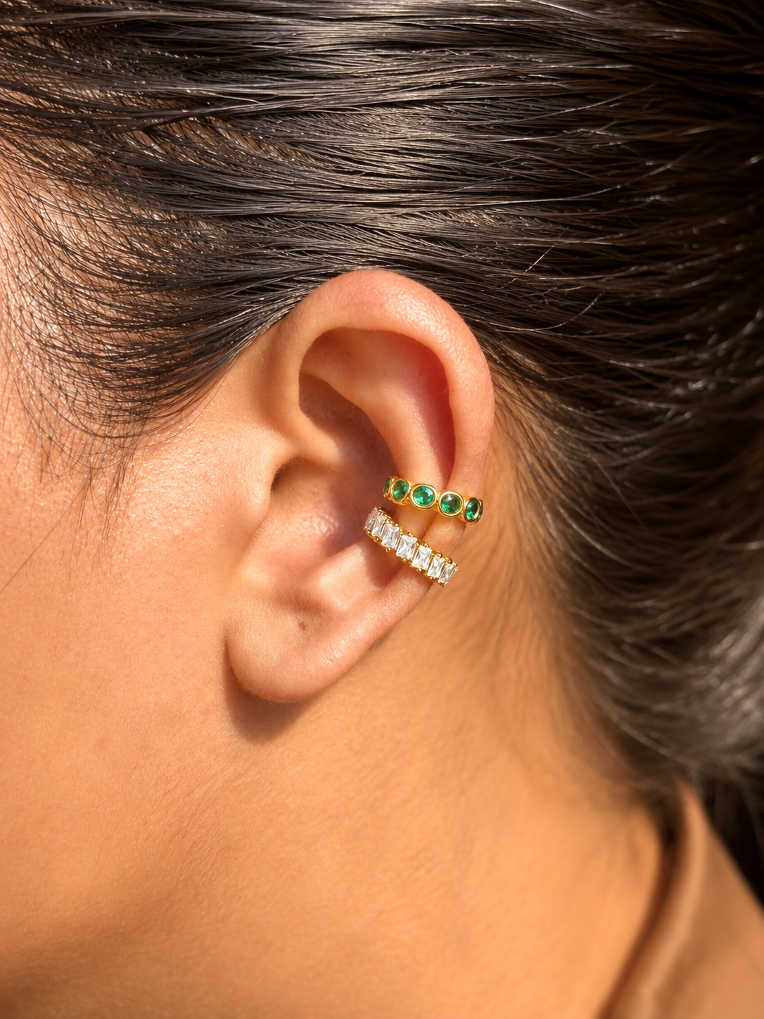 Close-up of Nyra gold-plated statement ear cuff — sleek 18k gold-plated no-piercing single-piece cuff for festive ear stacks.