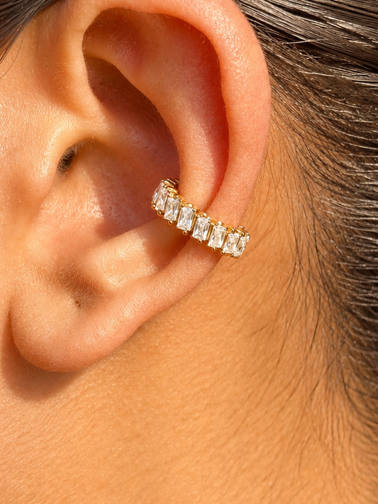 Nyra gold statement ear cuff styled for festive looks — no-piercing single-piece cuff for evening and wedding occasions.