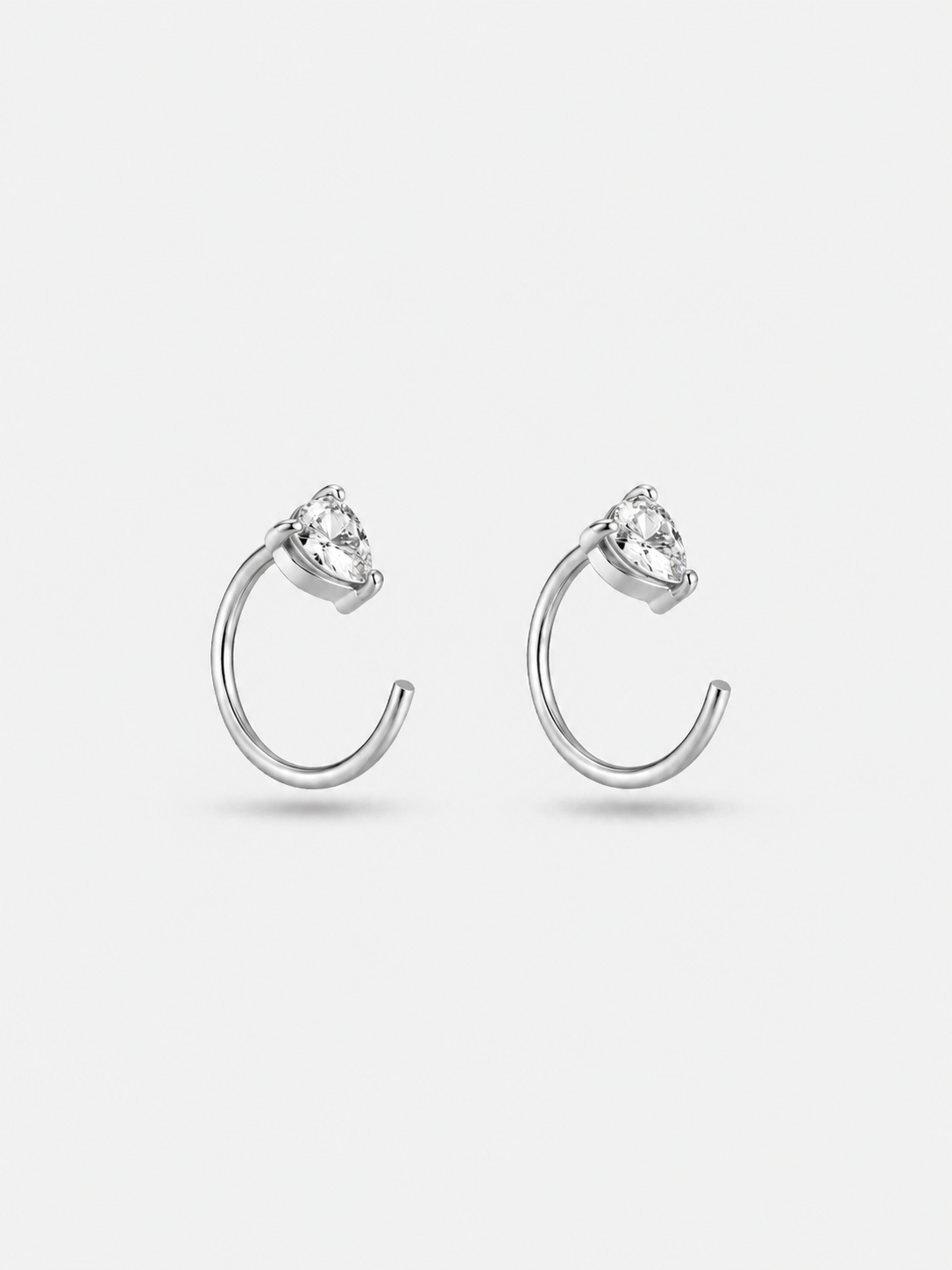 Pair of sterling silver pear hoop earrings in silver finish — versatile poke-free hoops for office and casual.