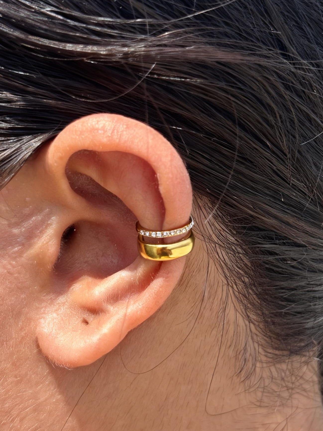 Close-up of gold-plated Kiara ear cuff — sleek lightweight no-piercing cuff for everyday and casual styling.