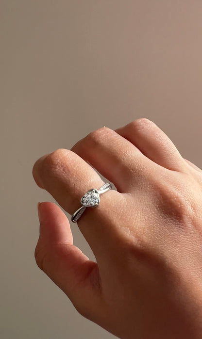 Styled view of Amora heart-cut moissanite ring — sterling silver bridal ring for evening and gifting.