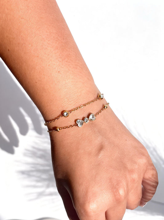 18k gold-plated layered bow bracelet — sleek layerable bow bracelet, anti-tarnish and waterproof for everyday and casual wear.