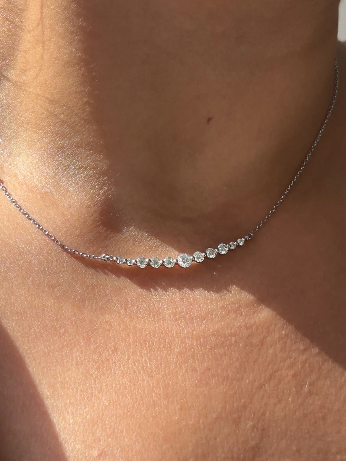 Styled view of Croma moissanite necklace — 925 sterling silver pendant necklace for everyday luxury and gifting.