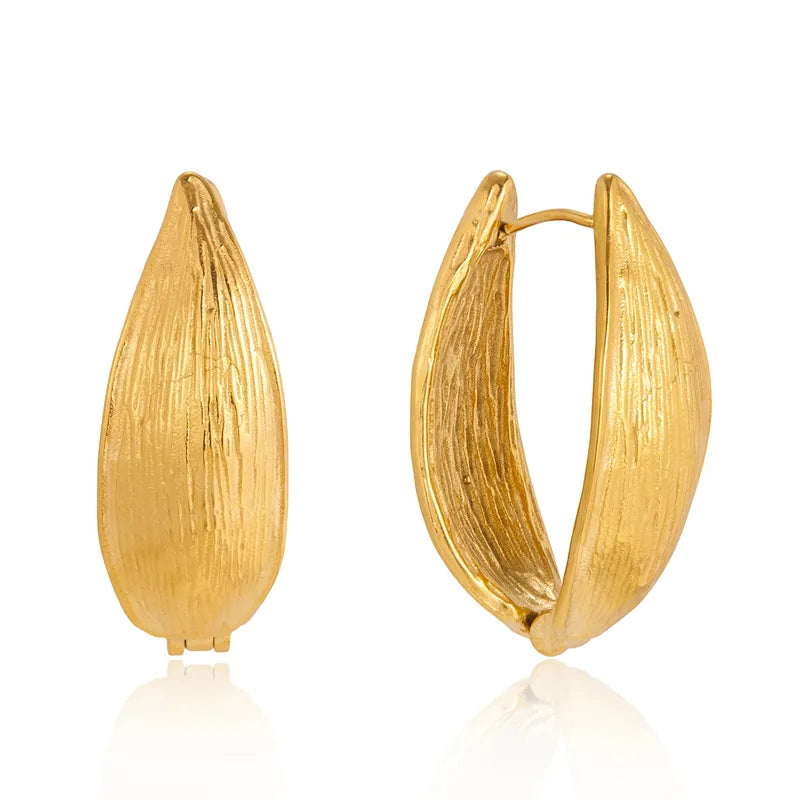 Pair of chunky 18k gold-plated Liva hoops styled for office and evening — bold anti-tarnish gold hoops.